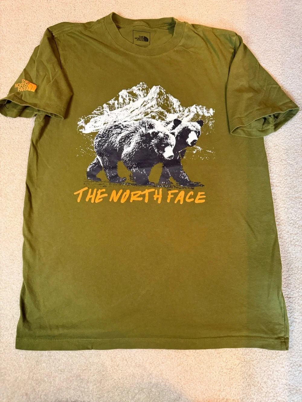The North Face Olive Green Tee with White and Black Bear Graphic and Orange Logo